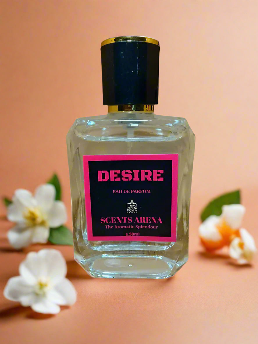 Perfume bottle labeled 'Desire' by Scents Arena on a wooden surface.