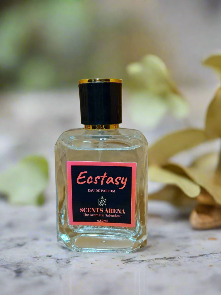 Perfume bottle labeled 'Ecstasy' by Scents Arena on a stone surface.