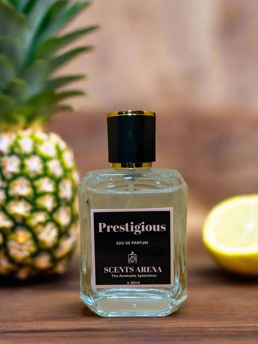 Clear perfume bottle with black cap labeled 'Prestigious' by Scents Arena, on wooden surface