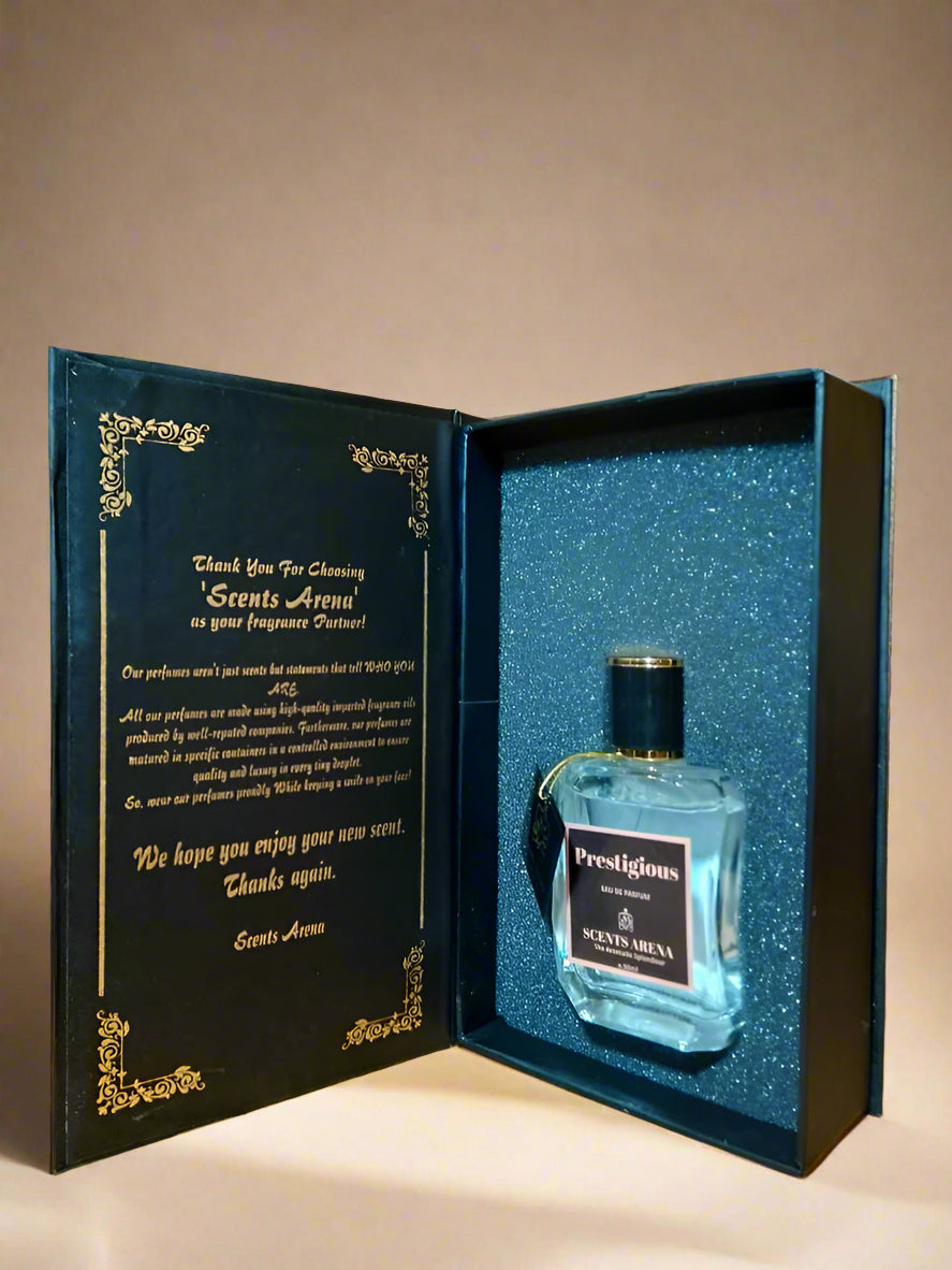 Perfume bottle in a decorative box with Scents Arena branding on a wooden surface