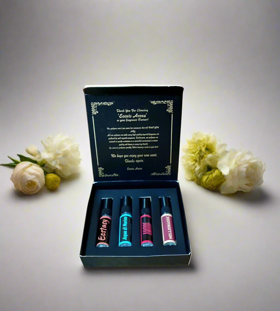 Set of small bottles with colorful labels in a black box on a wooden surface